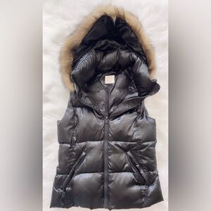Brand new w/o tags. Unisex down puffer vest w/ detachable  hood. Quality item.